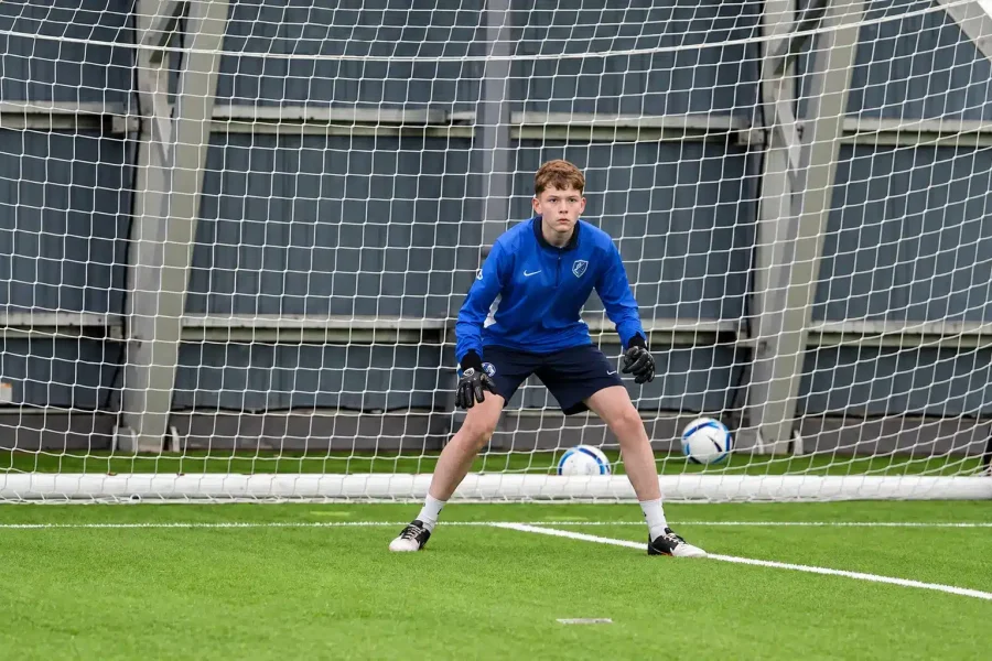 Focused Goalkeeper in Training Net